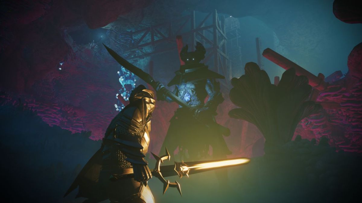 Image of a player in Enshrouded about to battle a large enemy. The player is in a blue-lit cavern.