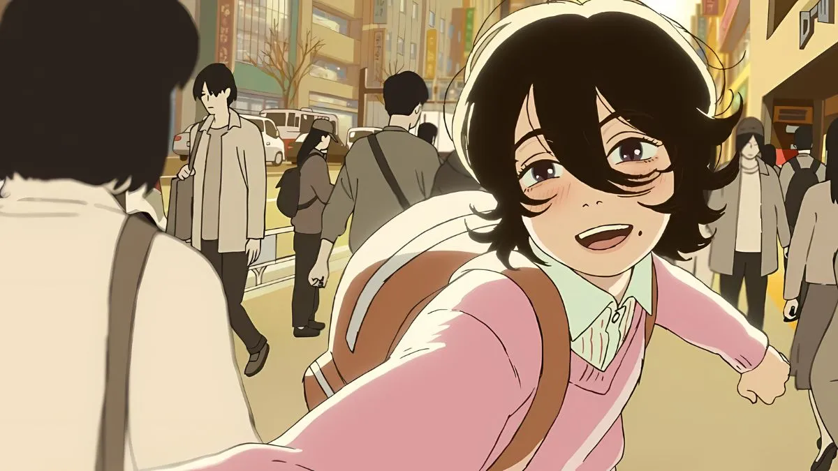 Look-Back-anime-film-screencap-of-one-of-the-characters-running-and-smiling-through-a-crowded-city-street